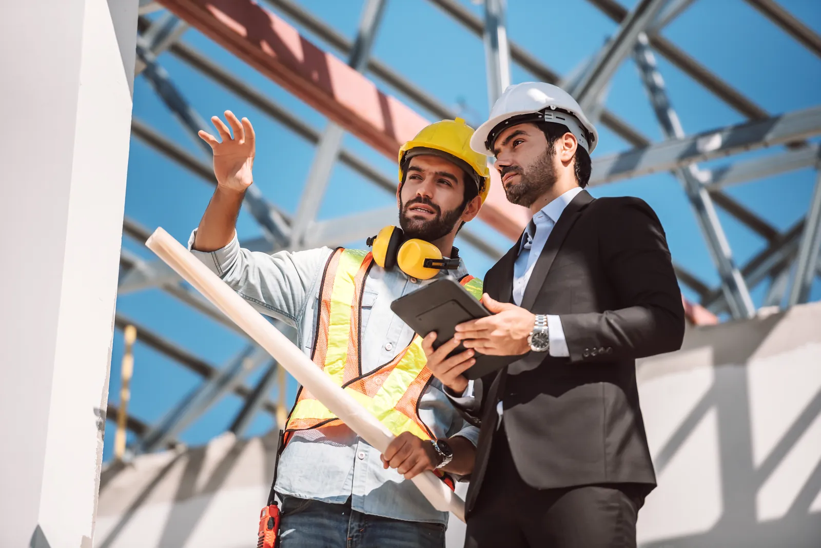Construction professionals reviewing work on site